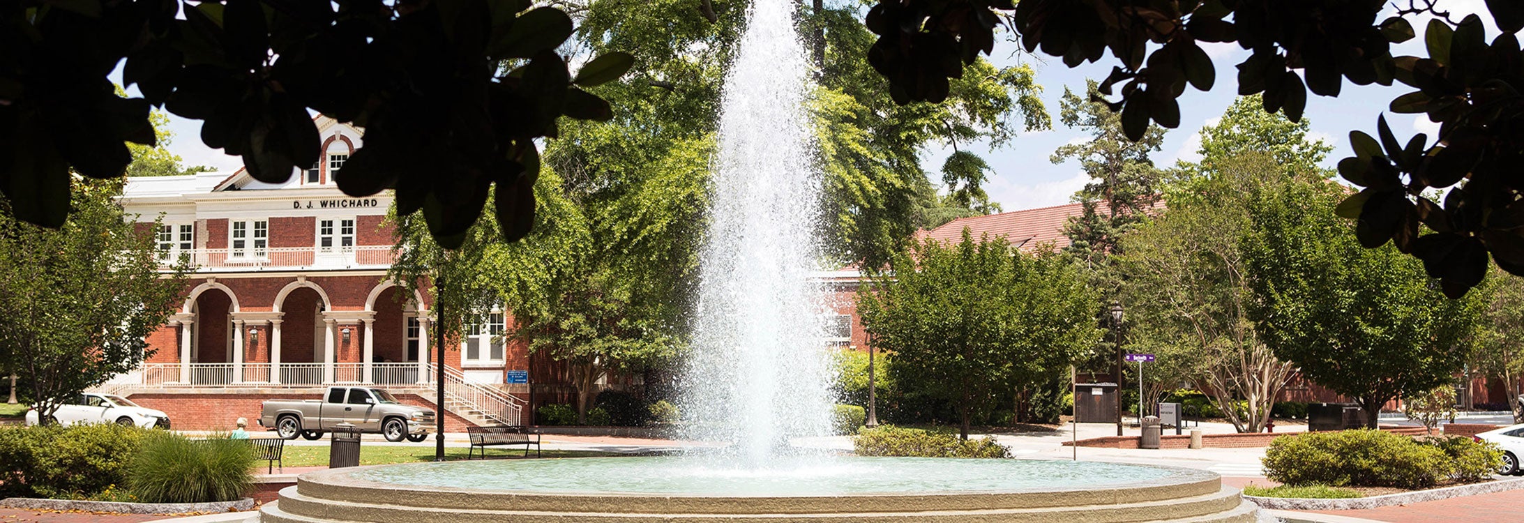 Image of fountain on main campus with Whichard building in the background